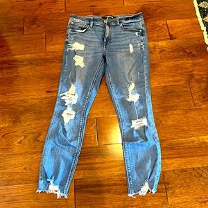 Express stretch and performance mid rise ankle ripped jeans